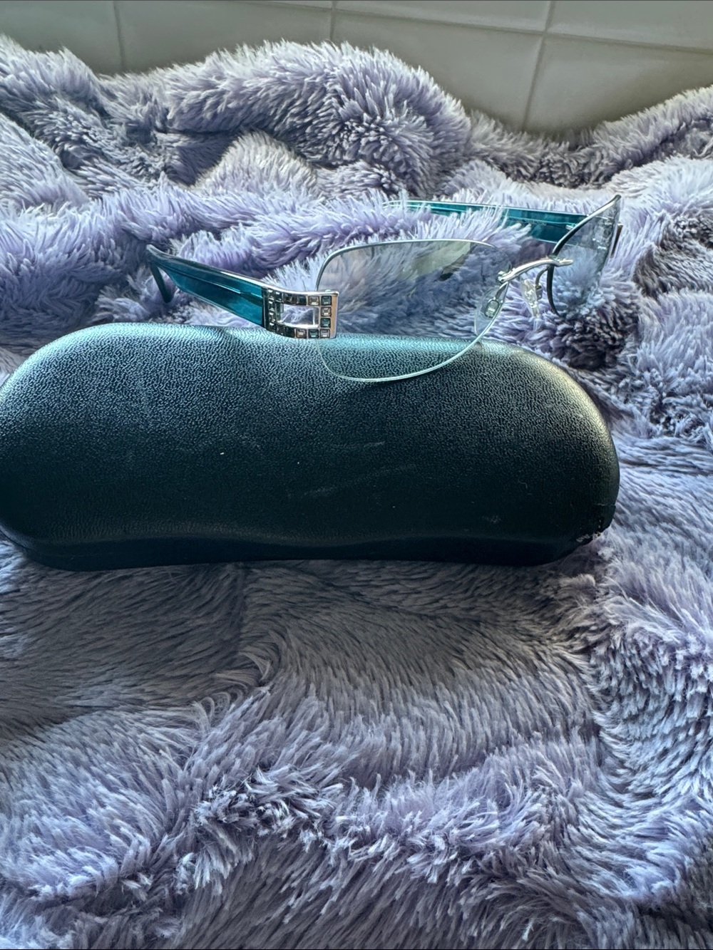 Daniel Swarovski Rimless Teal Women's Sunglasses with Decorative Temples.